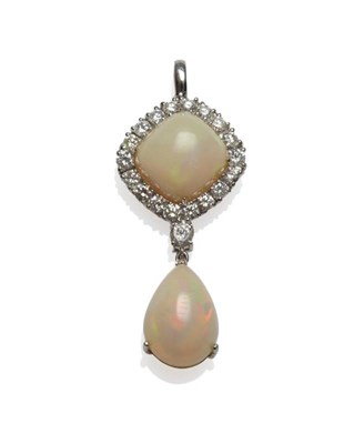 Lot 509 - An 18 Carat White Gold Opal and Diamond Pendant, a square cabochon opal within a border of...