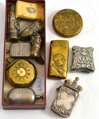 Lot 153 - Assorted novelty vestas including a brass vesta embossed with Oriental figures and set with a...