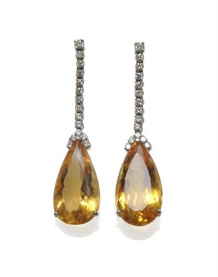 Lot 510 - A Pair of 18 Carat White Gold Citrine and Diamond Drop Earrings, a row of round brilliant cut...