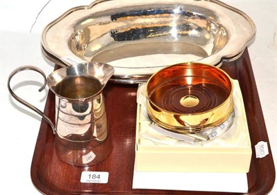 Lot 184 - Carrs silver gilt commemorative coaster in original box, pair of oval plated serving dishes and...