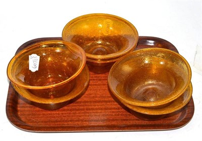 Lot 190 - A set of six glass bowls attributed to James Couper & Sons, Glasgow Clutha, circa 1900, blown amber