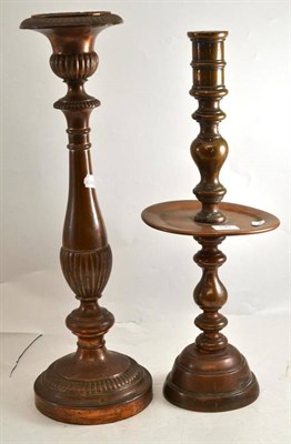 Lot 196 - Two large copper candlesticks