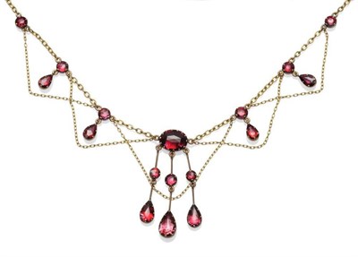 Lot 515 - A Foil Backed Garnet Necklace, the faceted garnets collet set in fringe style, with chain swags, on