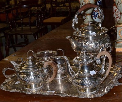 Lot 220 - A good quality plated on copper tea service with foliate chased and repousse decoration, comprising