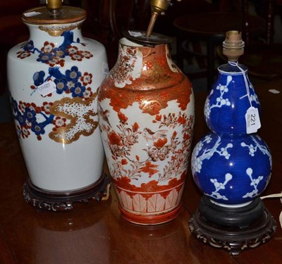 Lot 221 - A Kutani vase and a blue and white gourd vase (both converted to table lamps) and a modern Oriental