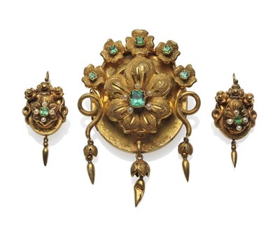 Lot 517 - A Victorian Demi-Parure, of floral form centrally, set with a foil backed emerald and seed...