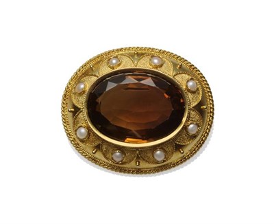 Lot 518 - A Smokey Quartz and Split Pearl Brooch, the oval mixed cut smokey quartz within a yellow...