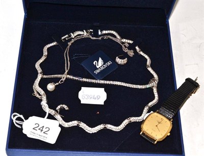 Lot 242 - A Swarovski crystal necklace and earrings, a line bracelet, a Brazilian pearl and diamond...