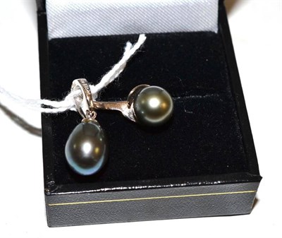 Lot 262 - An 18ct white gold black cultured pearl ring and a pendant stamped '14 K 505'