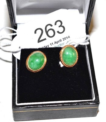 Lot 263 - A pair of jade earrings, stamped '14K'