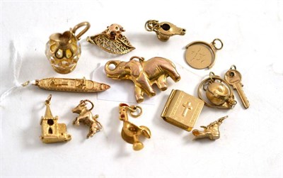 Lot 291 - Fourteen charms, mainly 9ct gold, including an elephant, a ship, a shell, a boot, etc