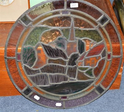 Lot 317 - A 20th century stained, painted and leaded glass 2' Roundel, depicting a thatched cottage,...