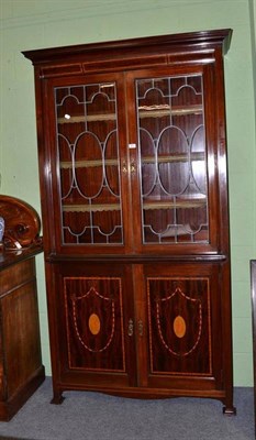 Lot 351 - Edwardian mahogany inlaid bookcase with leaded glass doors