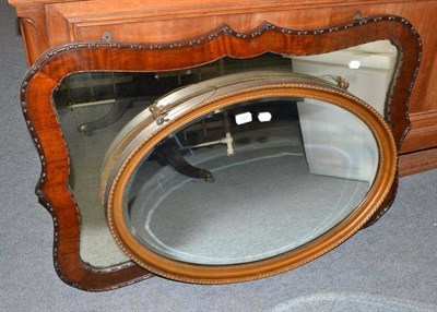 Lot 372 - Gilt framed oval wall mirror and a carved walnut framed wall mirror