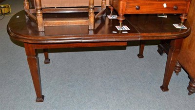 Lot 385 - A mahogany extending dining table