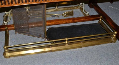 Lot 400 - A 19th century brass fender and two fire screens