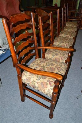 Lot 404 - Set of eight reproduction oak ladder back dining chairs including two carvers