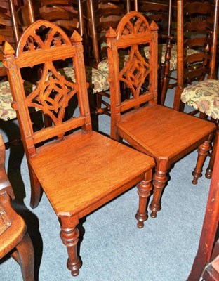 Lot 405 - A pair of Gothic oak panelled hall chairs