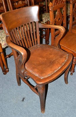 Lot 406 - Early 20th century oak desk chair