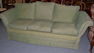 Lot 410 - A three seater upholstered settee in a green trellis pattern