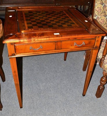 Lot 428 - A reproduction yew wood games table with single drawer