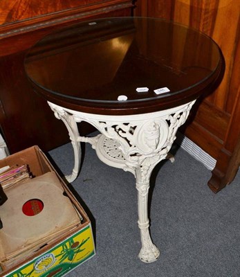 Lot 546 - A white painted cast iron pub table and glass top