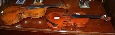 Lot 547 - Two 19th century German violins, one full size 'Copy of a Stainer', the other half size with no...