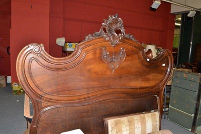 Lot 552 - A Continental carved walnut double bed