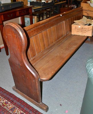 Lot 563 - A large pine pew