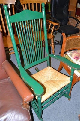 Lot 569 - A green painted rocking chair