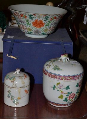 Lot 7 - Chinese flared pedestal bowl decorated with flowers and two covered jars (3)