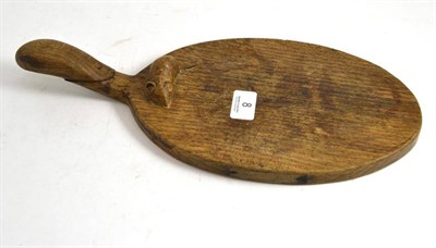 Lot 8 - A Robert 'Mouseman' Thompson oak cheese board, with carved mouse signature on the board...