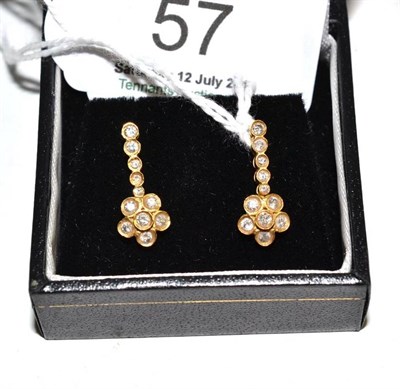 Lot 57 - A pair of 18ct gold diamond set earrings