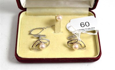 Lot 60 - A Mikimoto cufflink and tie stud set, of contemporary form, each piece set with a cultured...