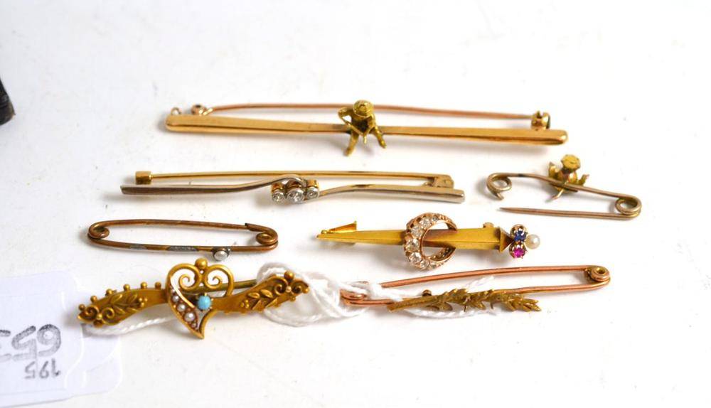 Lot 67 - A diamond bar brooch, a diamond, sapphire, ruby and pearl bar brooch and five other bar...