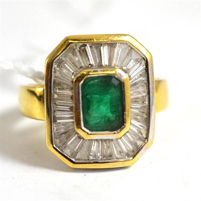 Lot 73 - An 18ct gold emerald and diamond cluster ring