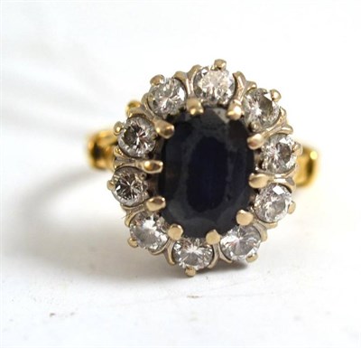 Lot 78 - A sapphire and diamond cluster ring