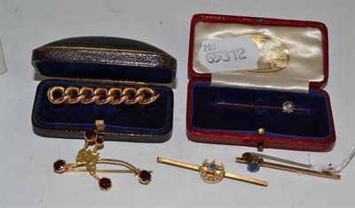 Lot 79 - Five assorted brooches with two boxes
