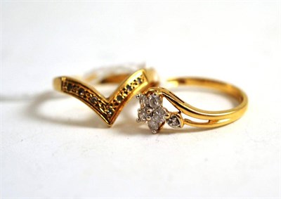 Lot 93 - A 9ct gold diamond cluster ring and a 9ct gold wishbone ring (2)