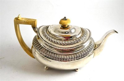 Lot 105 - A George III silver teapot with ivory handle, London 1916