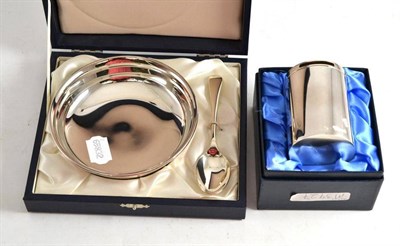 Lot 118 - Silver Christening bowl and spoon; and a silver money box, both in original boxes (2)