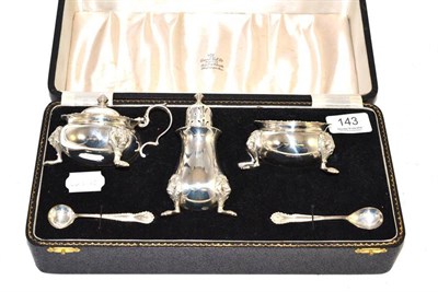 Lot 143 - A silver three piece cruet set in a fitted case