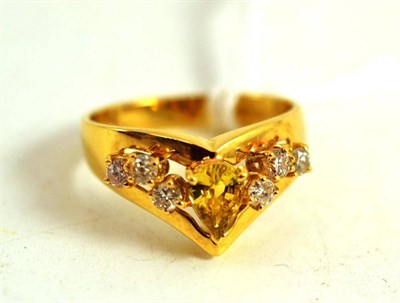 Lot 156 - An 18ct gold yellow sapphire and diamond ring, a pear cut yellow sapphire with three round...