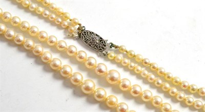 Lot 163 - A two row cultured pearl necklace with snap stamped 'STERLING SILVER'