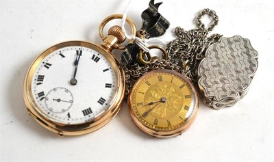 Lot 187 - A lady's fob watch, stamped '9CT', on a chain with attached silver vinaigrette and bow brooch,...