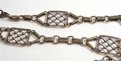 Lot 194 - A white metal fancy link belt