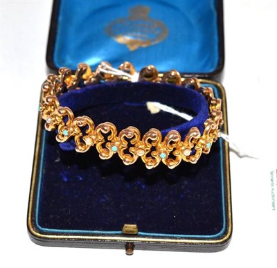 Lot 197 - An expanding turquoise and split pearl bracelet stamped '9'