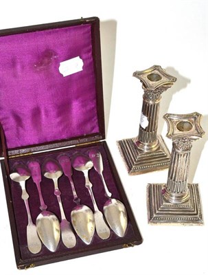 Lot 212 - Pair of silver dwarf candlesticks and a cased set of Continental spoons