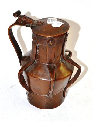 Lot 235 - Arts & Crafts copper lidded flagon with strap work detailing