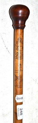 Lot 248 - A 19th century cane decorated with incised animals and figures